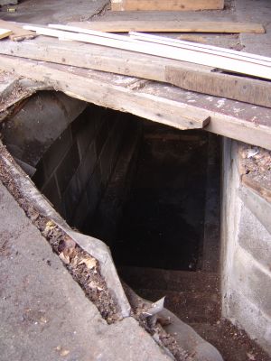 The garage used to be a working garage. This is the entrance to the inspection pit.